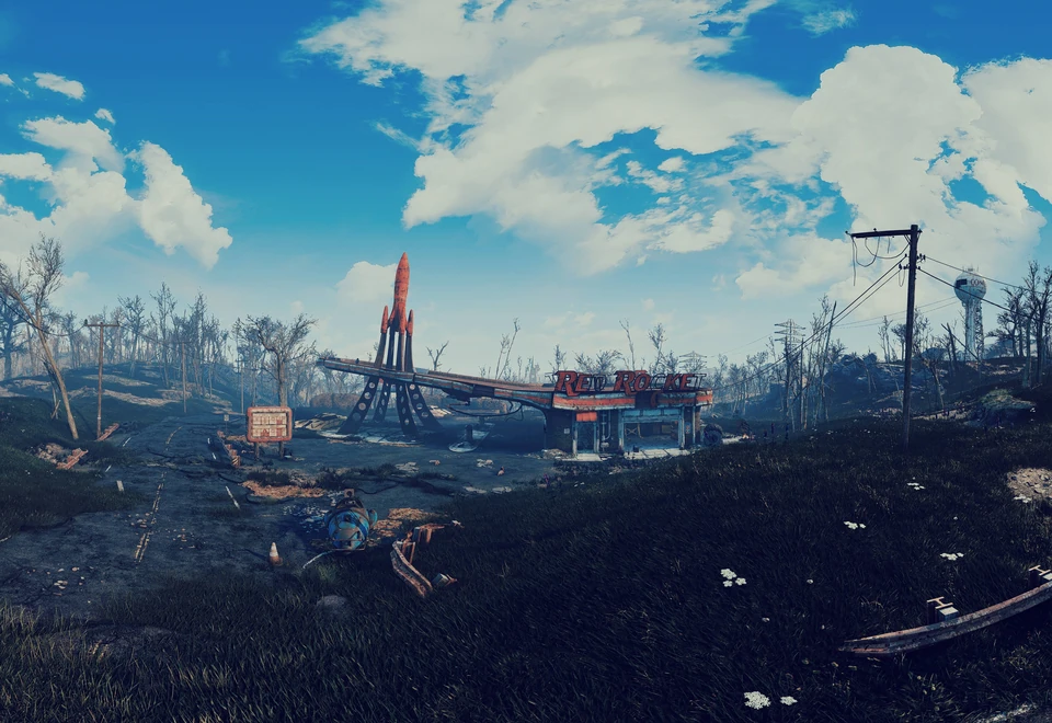 Red rocket-shaped sign among wasteland ruins under a bright blue sky with clouds