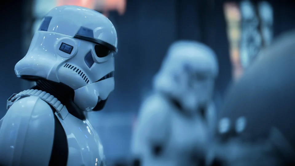 Close-up of a stormtrooper helmet with a second stormtrooper blurred behind