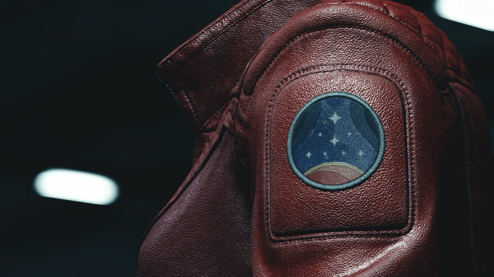 Close-up of a red leather jacket shoulder with a circular star patch