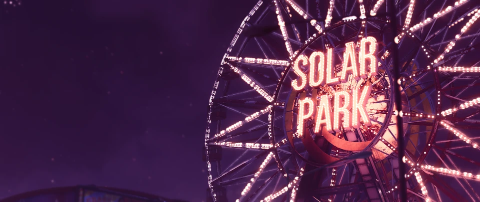 Solar Park ferris wheel lit in pink and purple at night